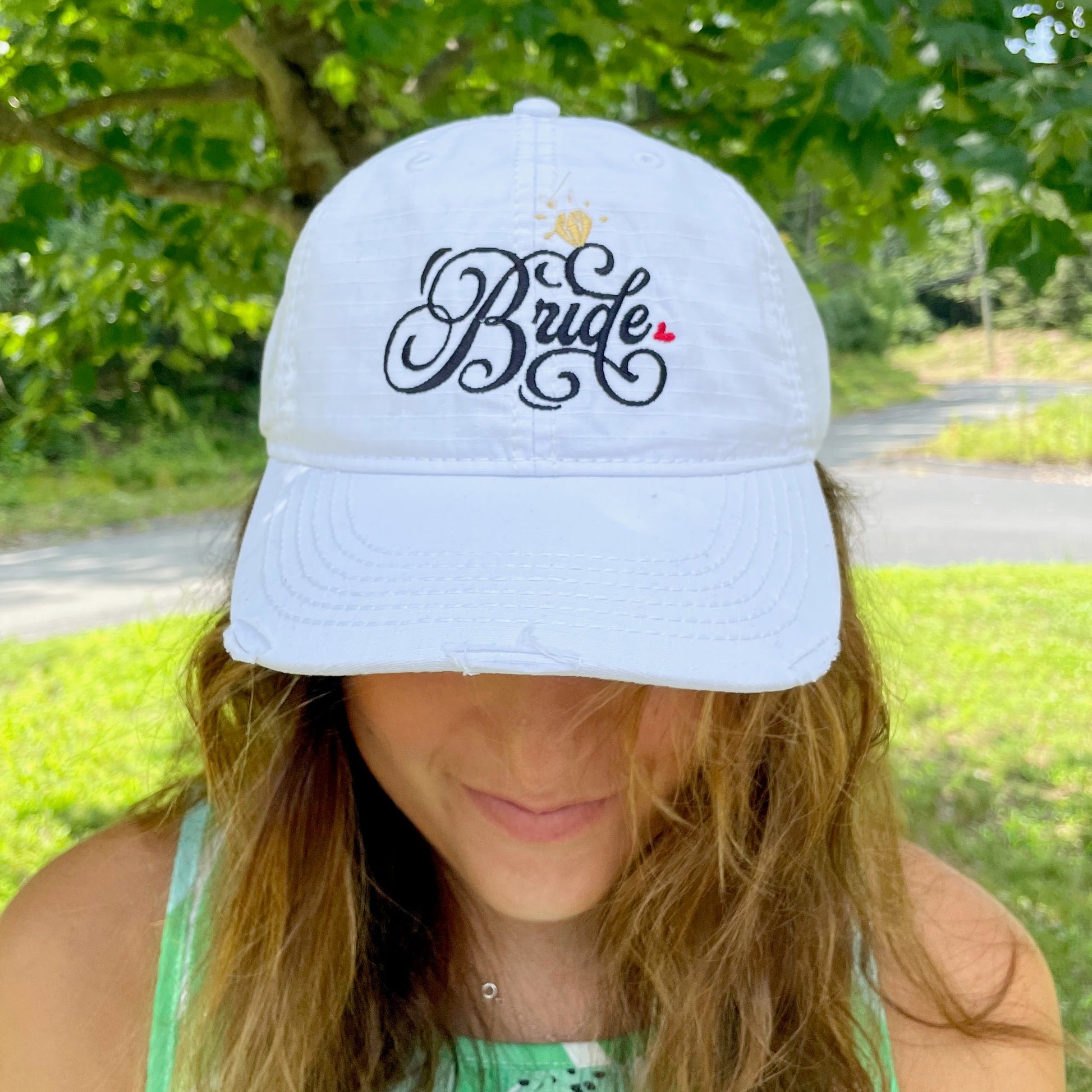 "Bride" Swirly Font with Colored Hearts White Embroidered Distressed Hat